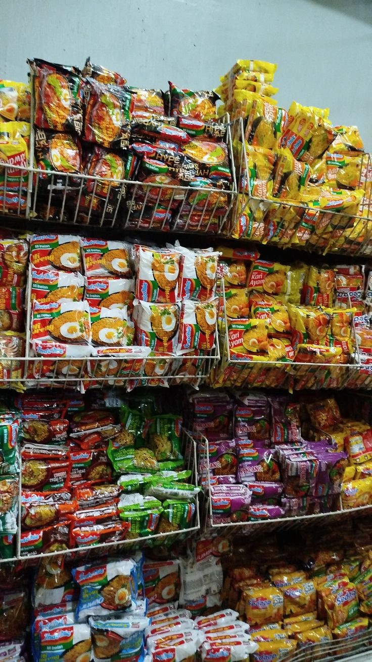 Vibrant instant noodles and snacks fill shelves, offering quick, delicious convenience for any craving.